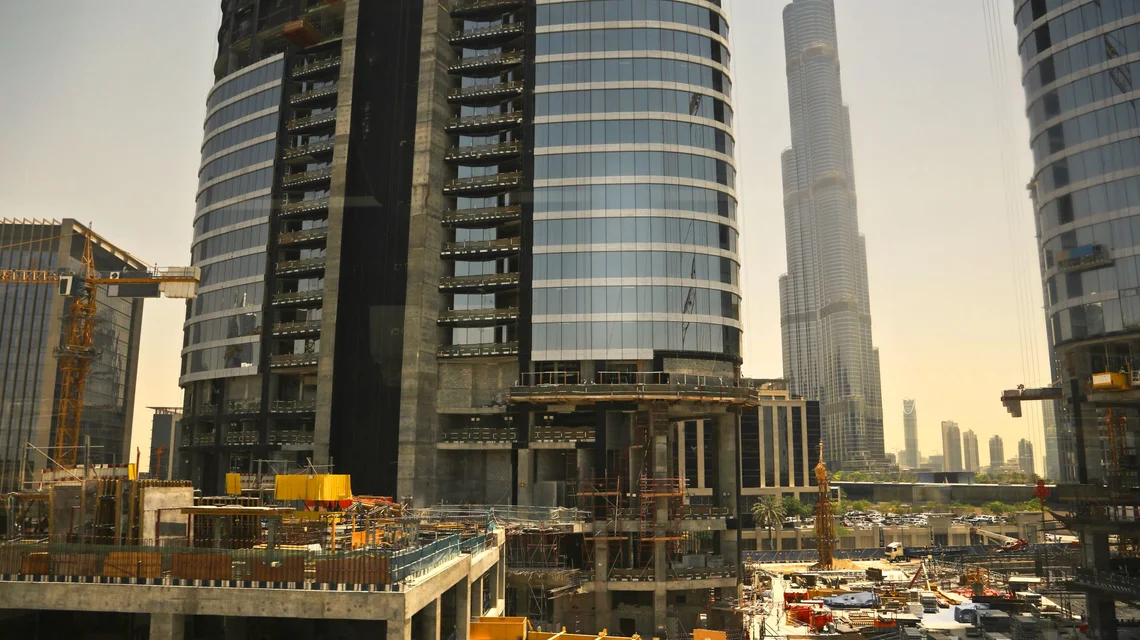Downtown Dubai under construction with the Burj Khalifa and tower cranes