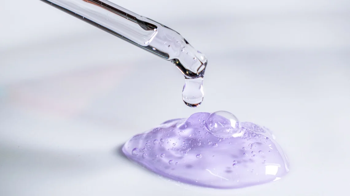 Pipette dispensing cosmetic serum during product formulation