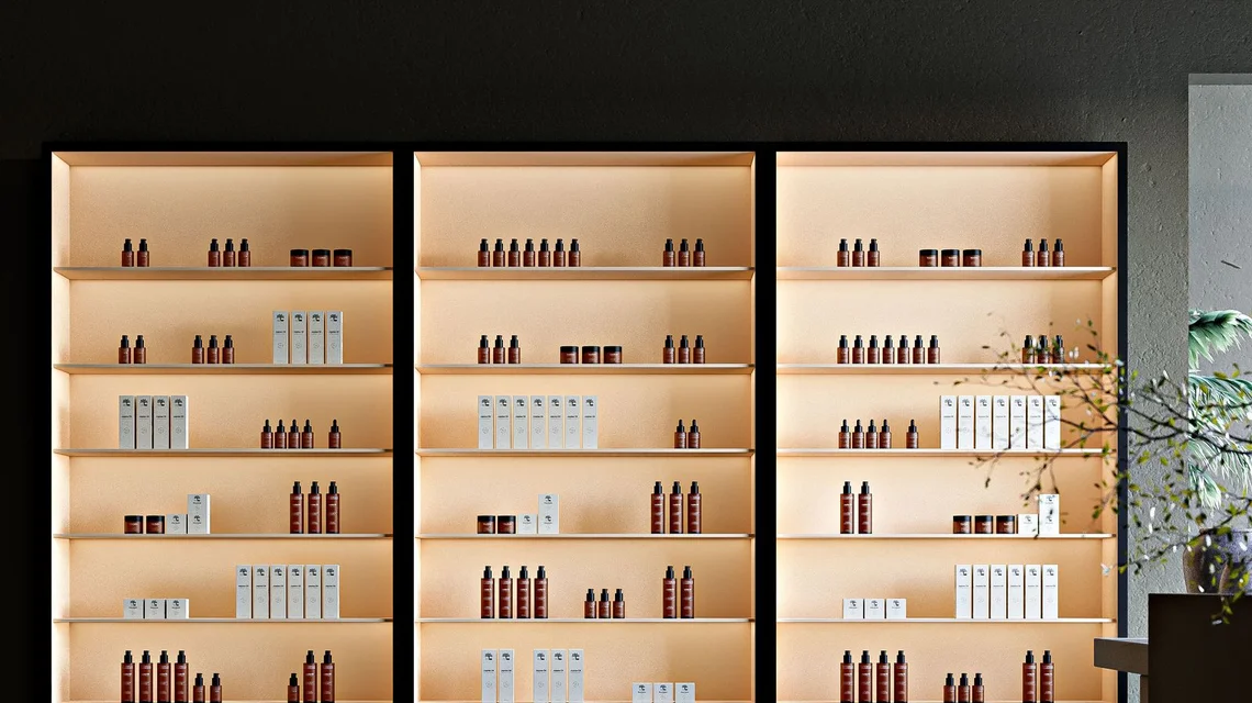 Beauty and skincare products displayed on elegant backlit shelves