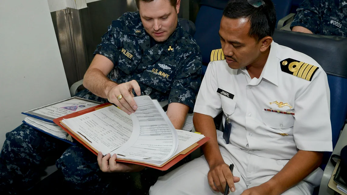 Officers reviewing shipping documents