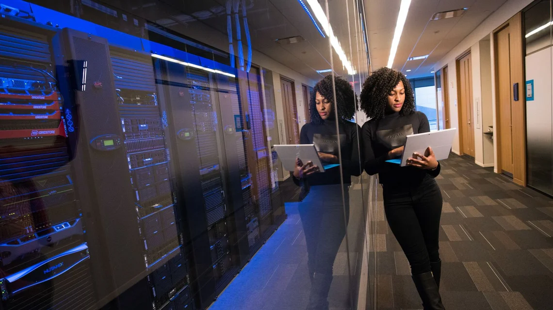 Technician working on network servers in a data center