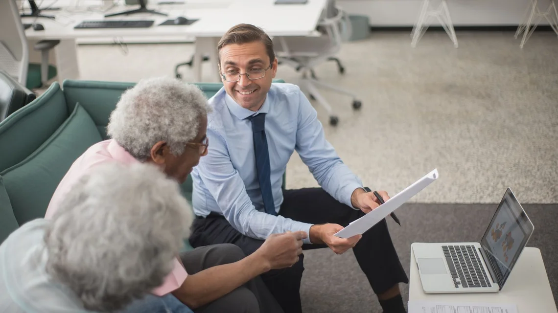 Adviser and client reviewing an overdue invoice and settlement plan