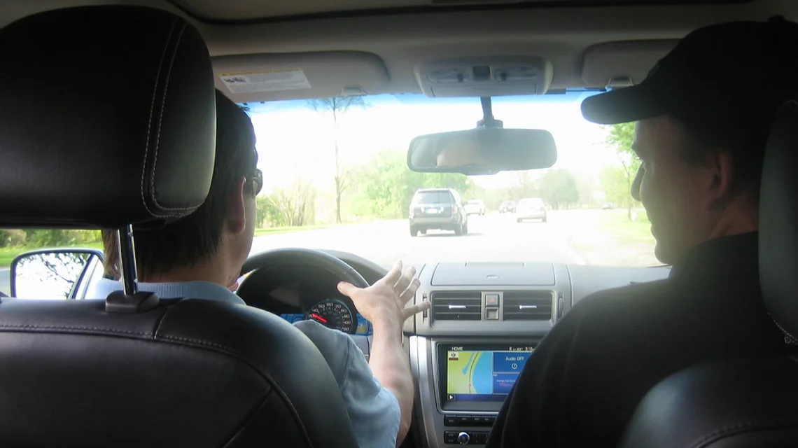 Learner driver and instructor in a dual-control training car