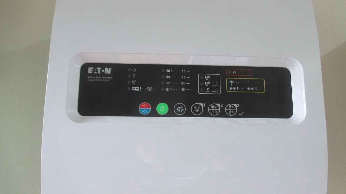 Fire alarm control panel mounted on a wall
