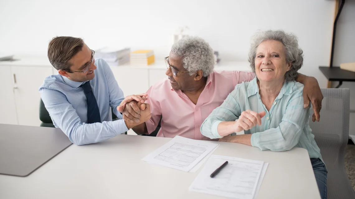 Family reviewing wealth and succession documents with an adviser