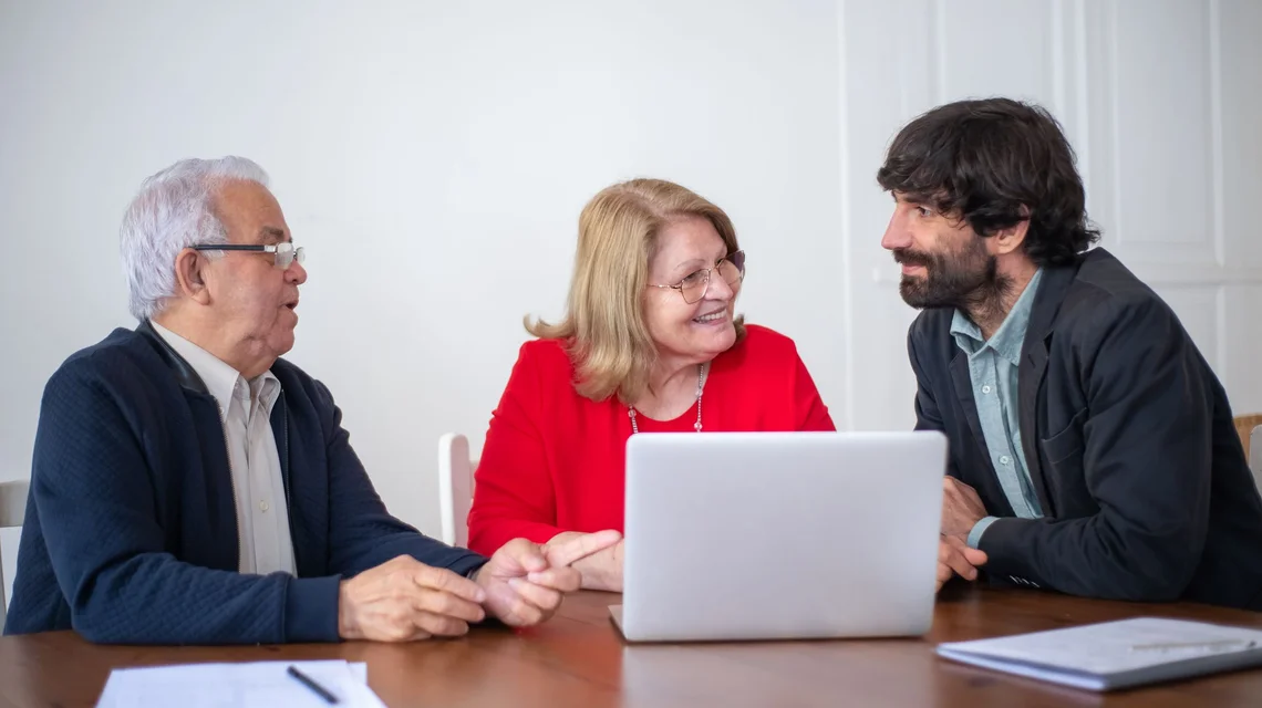 Senior couple planning their estate with a wealth adviser