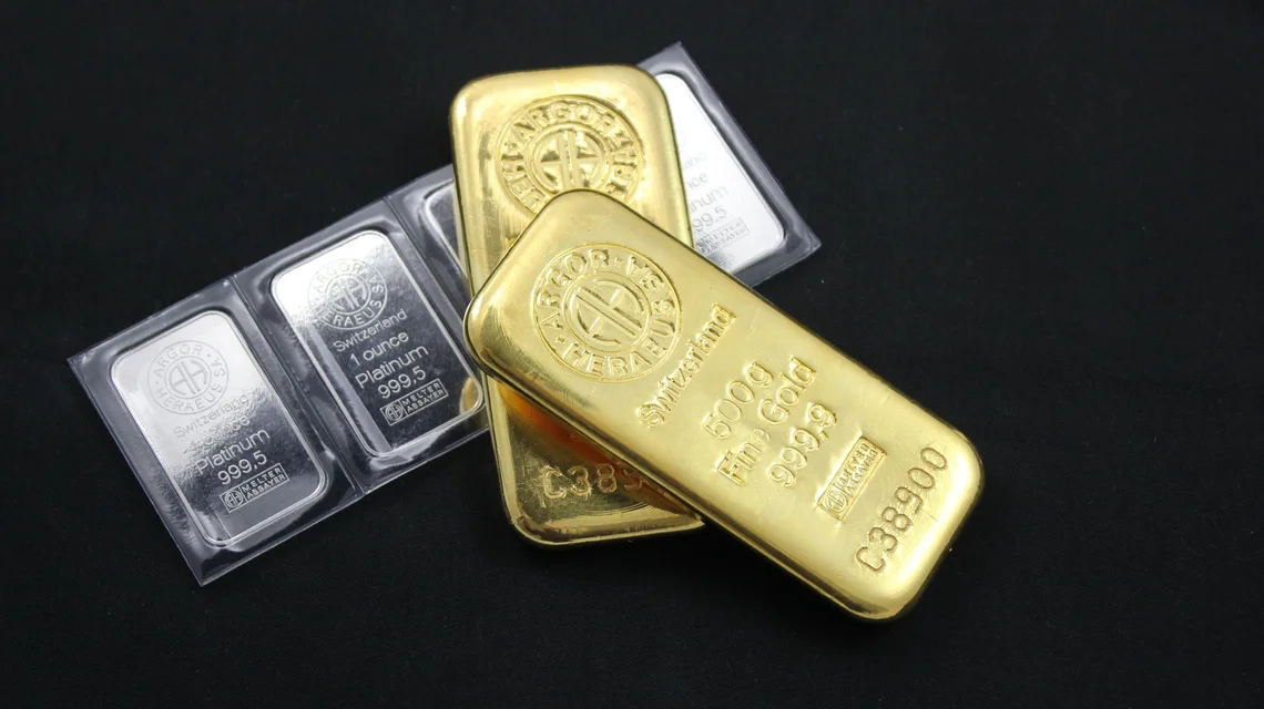 Investment grade 999.9 fine gold and platinum bullion bars in assay packaging