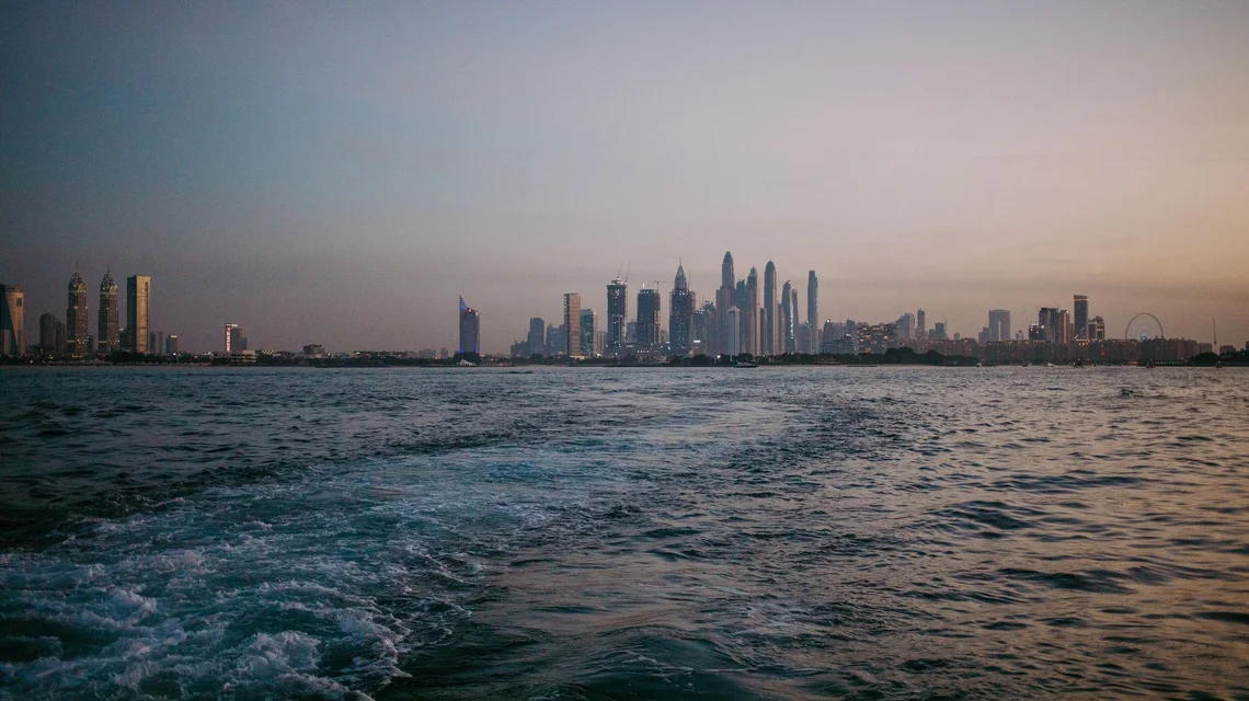 Dubai Marina skyline at dusk seen from the water