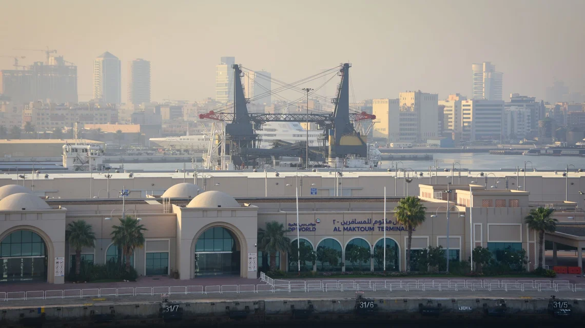 DP World port terminal cranes and the Dubai skyline