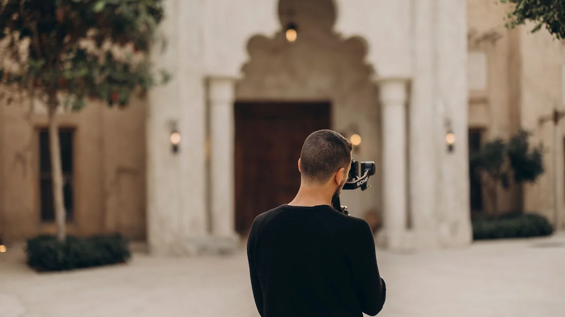 Videographer filming heritage architecture in Old Dubai