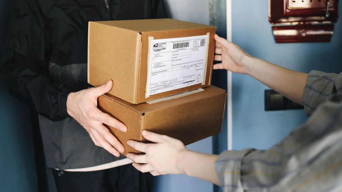 Warehouse team packing e-commerce orders for delivery in the UAE