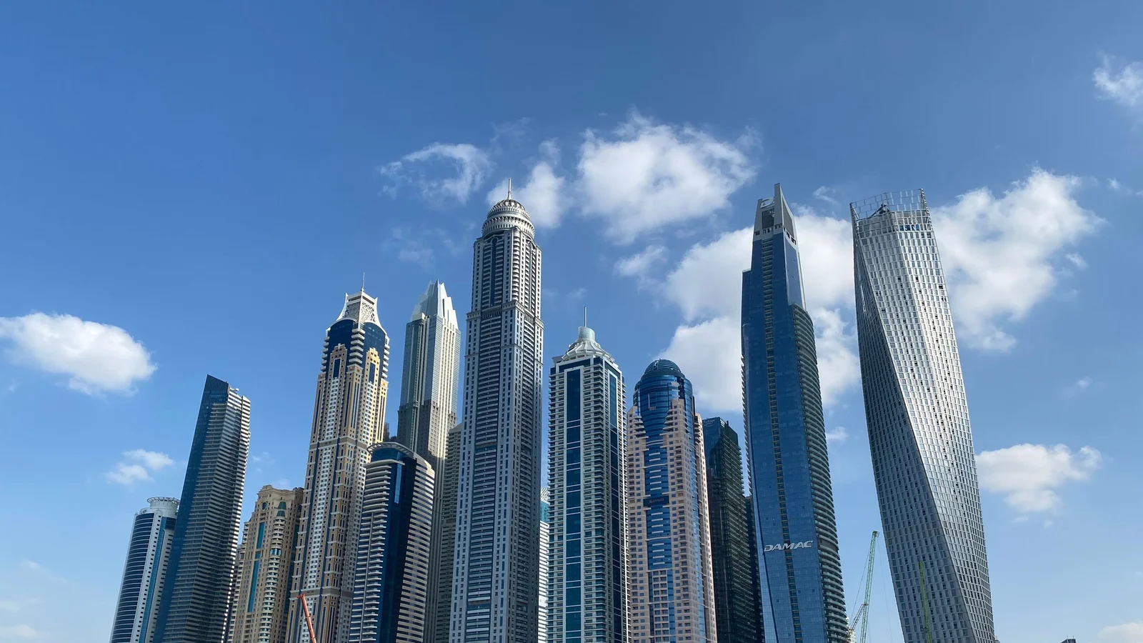 Buying Dubai Property Through a Company in 2026: The Share Transfer and 4% Question Nobody Can Answer With a Document, the Corporate Tax Inversion That Costs Owners Money, and Which Vehicles the Land Department Actually Registers — Dubai business setup