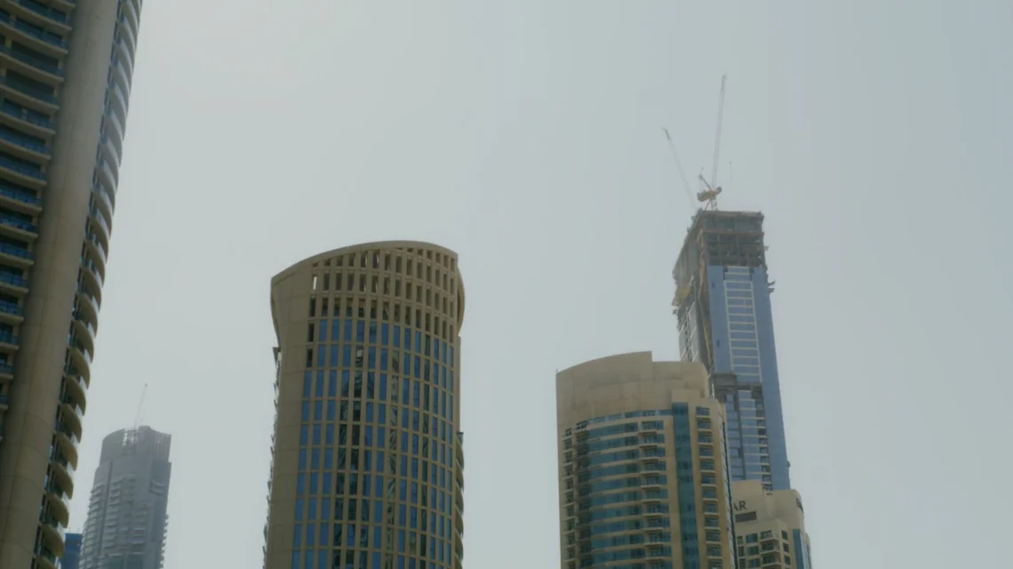 Dubai residential towers under construction against the skyline