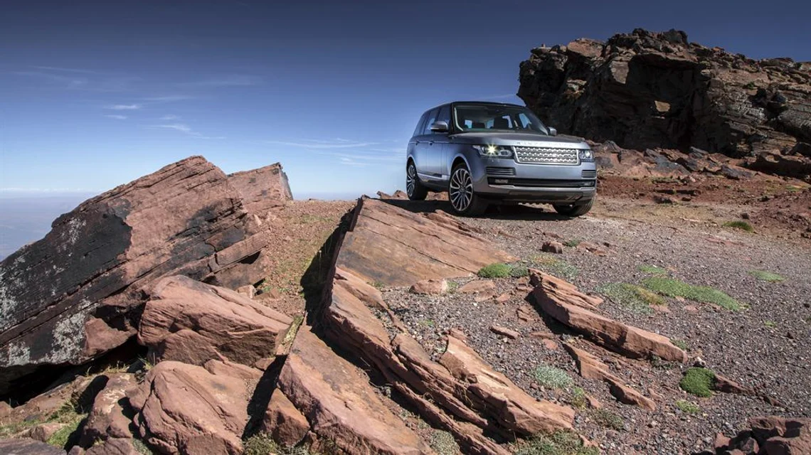 A four-wheel-drive vehicle in the desert dunes