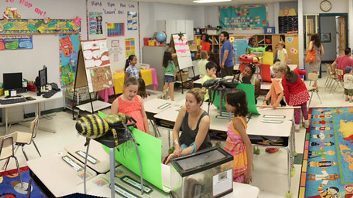 Students in a classroom with a teacher at a private school