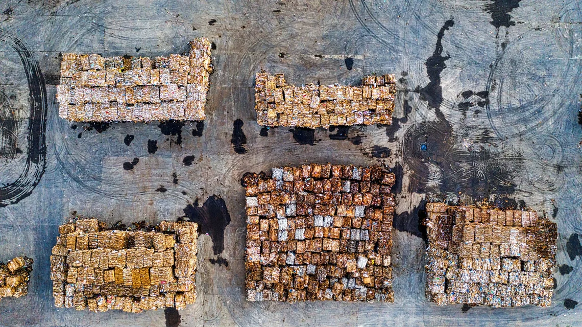Baled recyclable materials stacked at a waste processing plant