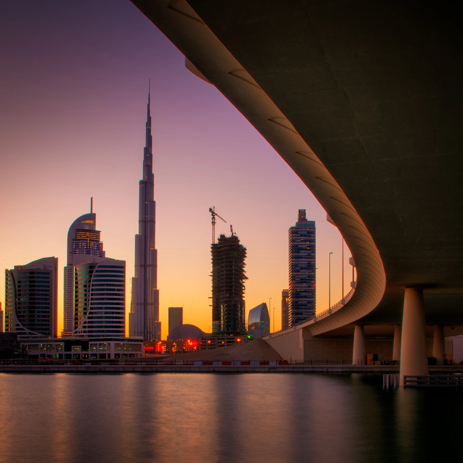 Dubai Business Bay towers reflected in water — VAT registration and compliance in the UAE