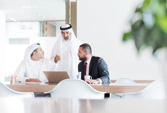 UAQ business setup consultants in a meeting